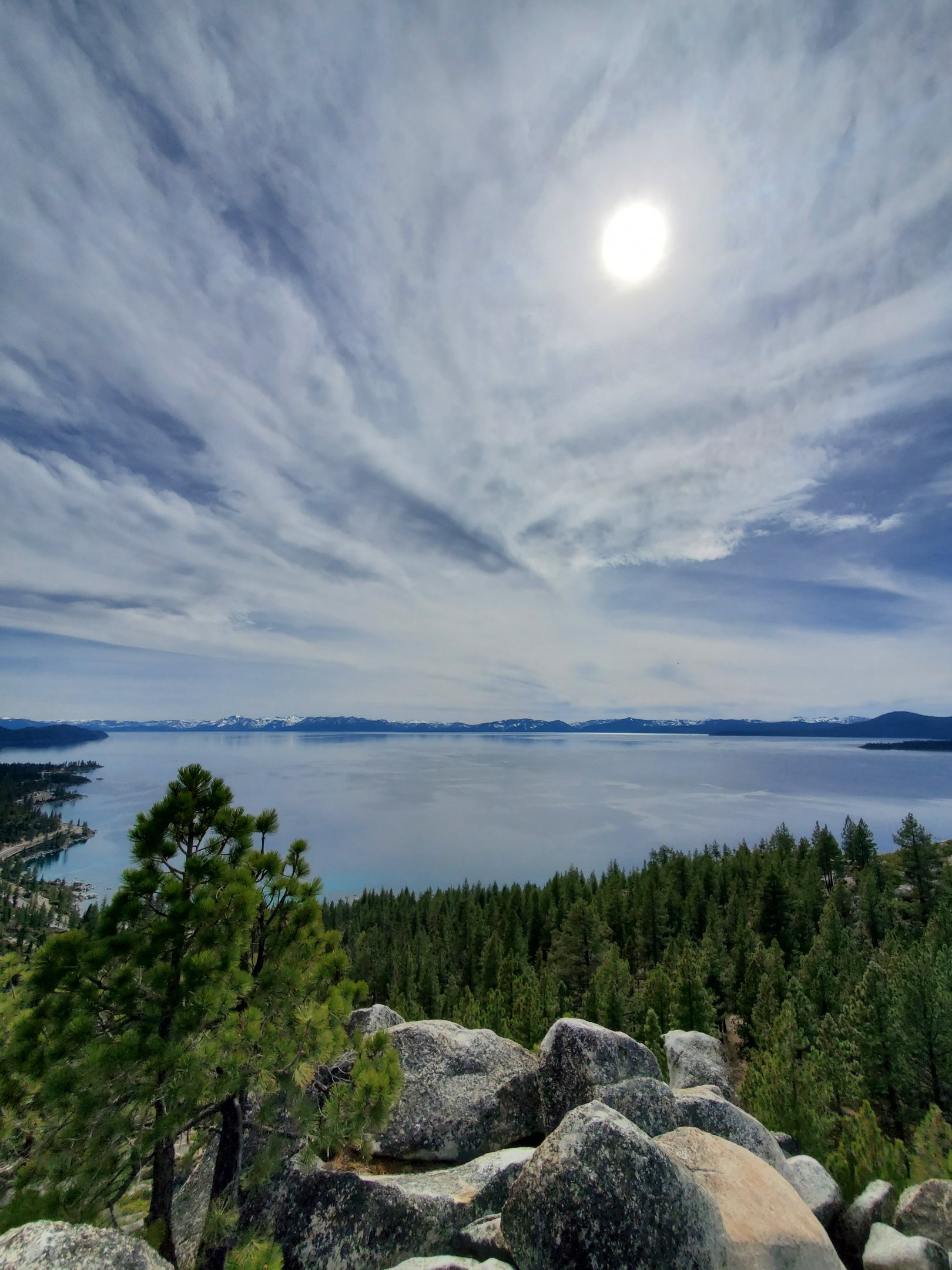 Summer view across Lake Tahoe with clear skies and granite peaks