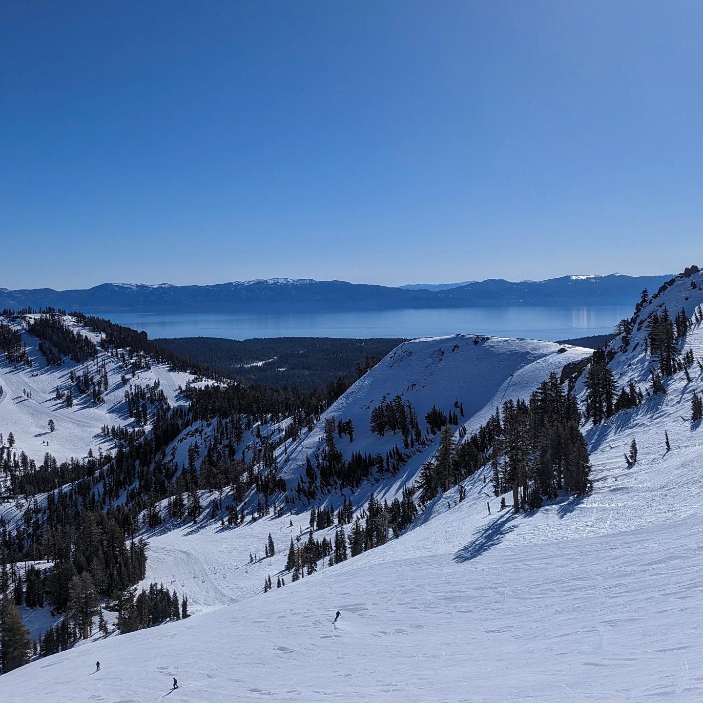 View of Lake Tahoe from the Alpine Meadows ridgeline at golden hour